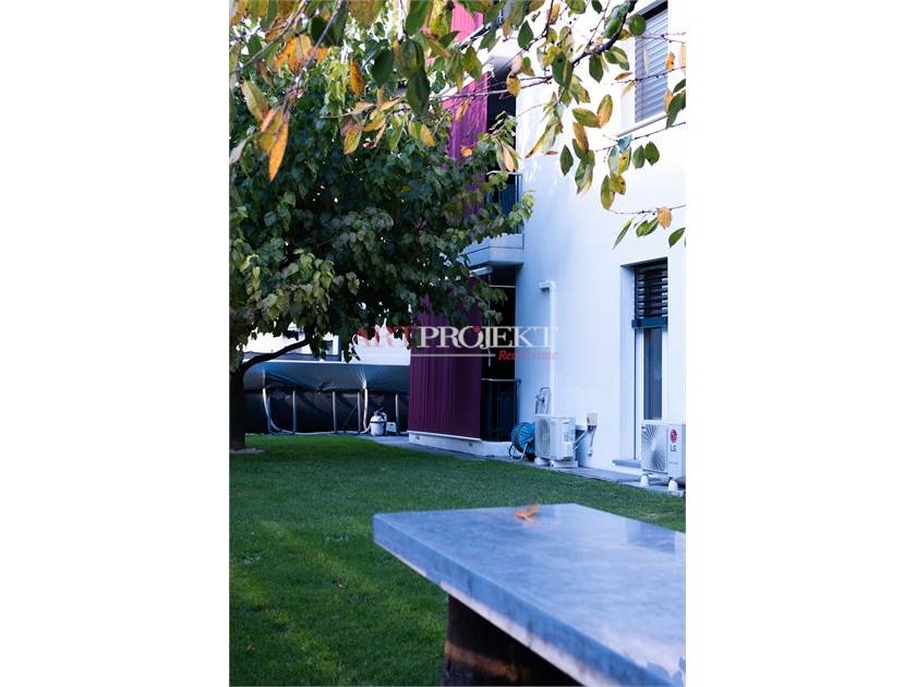 BELLISSIMO APPARTAMENTO CON GIARDINO A SANT'ANTONINO / ArtProjekt SA