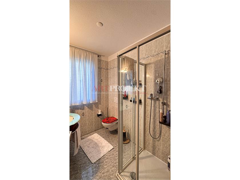 BELLISSIMO APPARTAMENTO CON GIARDINO A SANT'ANTONINO / ArtProjekt SA