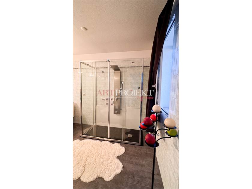 BELLISSIMO APPARTAMENTO CON GIARDINO A SANT'ANTONINO / ArtProjekt SA