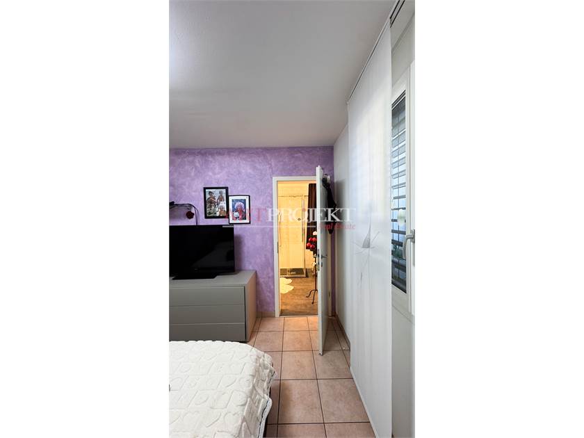 BELLISSIMO APPARTAMENTO CON GIARDINO A SANT'ANTONINO / ArtProjekt SA