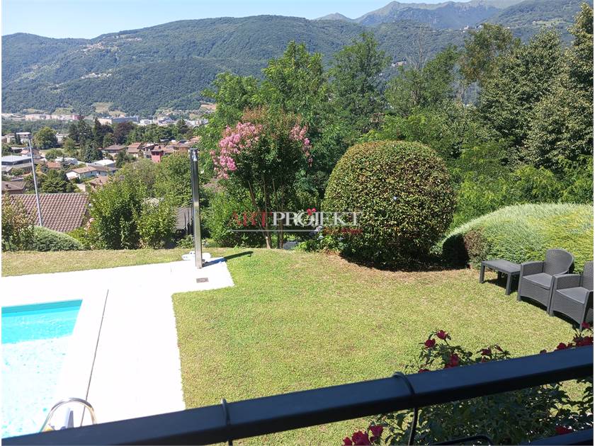 Comano – Elegante appartamento 2.5 locali con piscina e vista panoramica / ArtProjekt SA